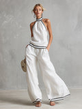 Elegantes, minimalistisches Set aus weißem Baumwoll-Leinen-Top mit Neckholder-Ausschnitt und weit geschnittener Hose