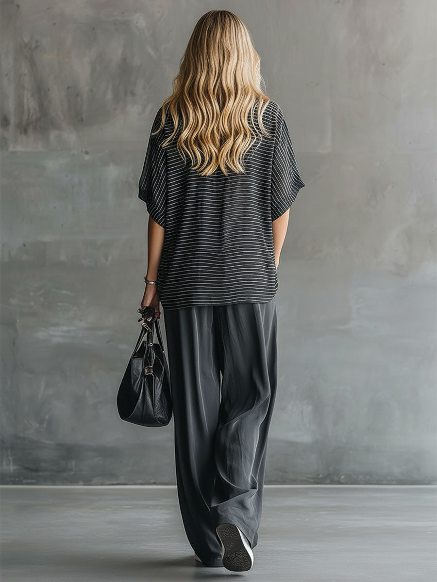 Stylisches und lässiges Set aus schwarzem Kurzarm-Oberteil und grauer Chiffonhose