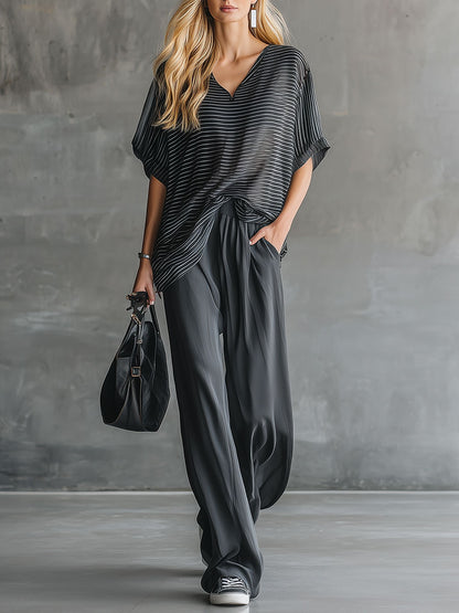 Stylisches und lässiges Set aus schwarzem Kurzarm-Oberteil und grauer Chiffonhose