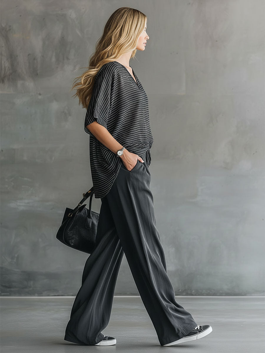 Stylisches und lässiges Set aus schwarzem Kurzarm-Oberteil und grauer Chiffonhose
