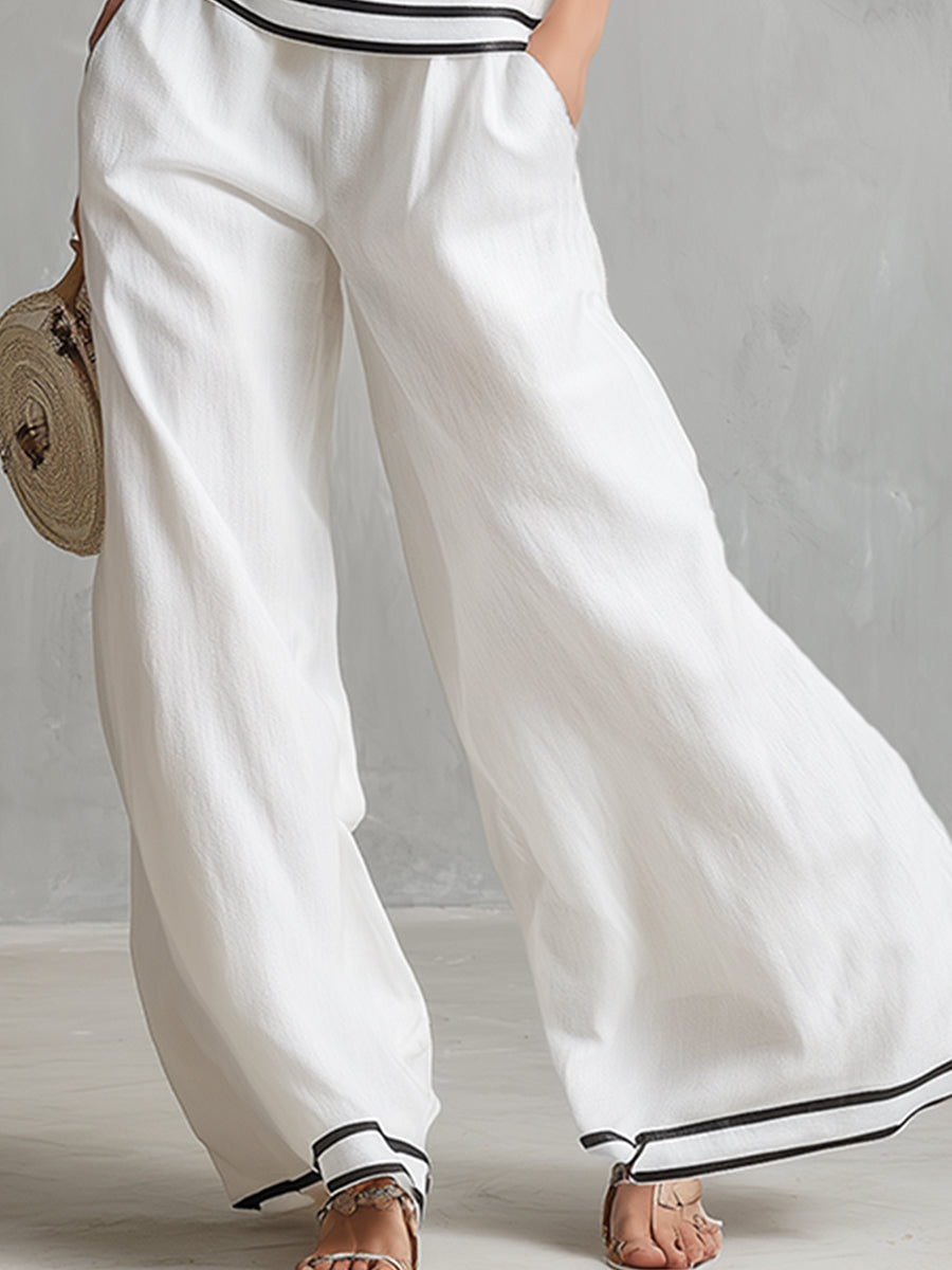 Elegantes, minimalistisches Set aus weißem Baumwoll-Leinen-Top mit Neckholder-Ausschnitt und weit geschnittener Hose