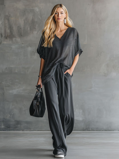Stylisches und lässiges Set aus schwarzem Kurzarm-Oberteil und grauer Chiffonhose